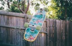 skateboard decorated with flamingos.jpg